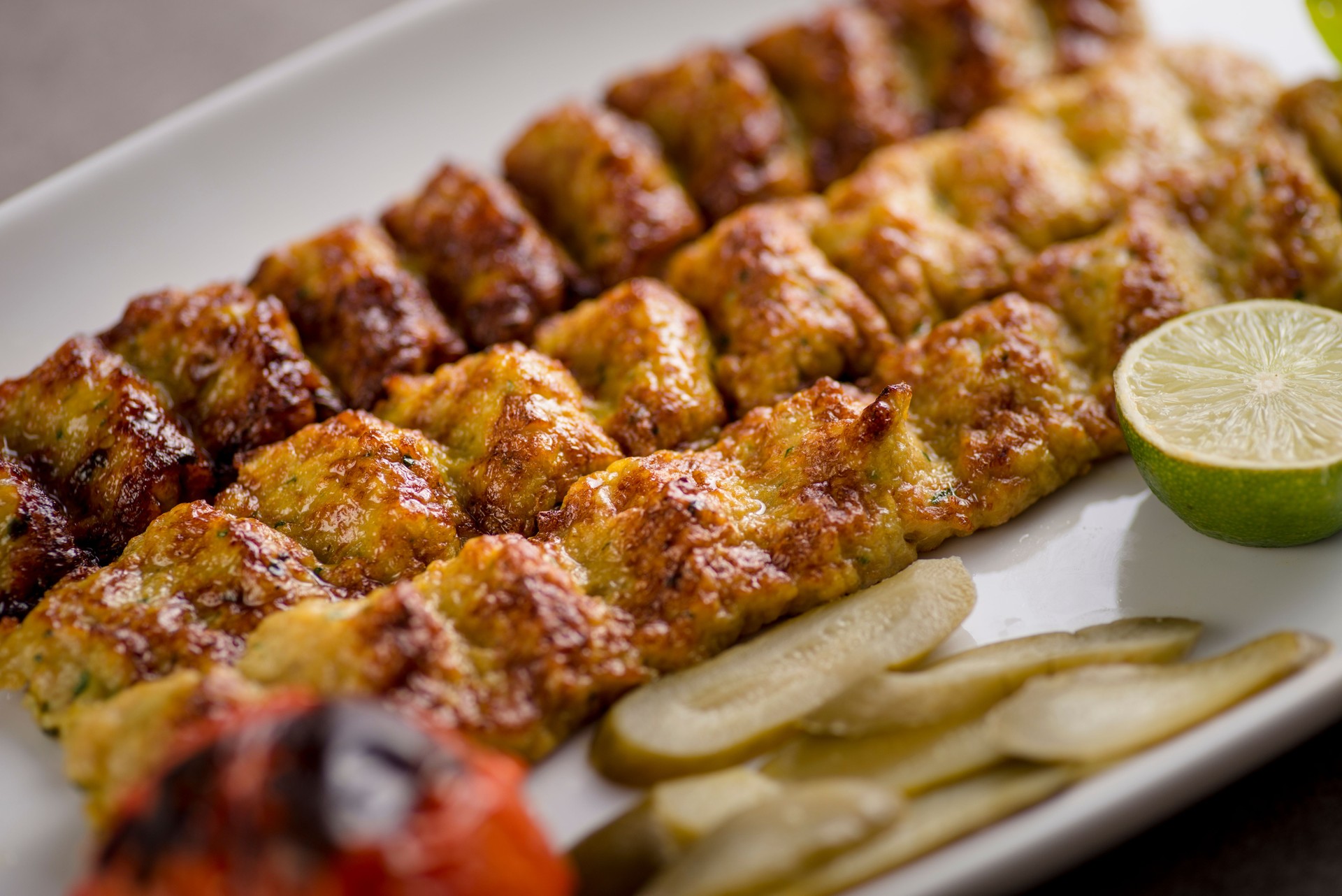 jujeh kebab kofta with lime served in dish isolated on grey background top view of arabic food