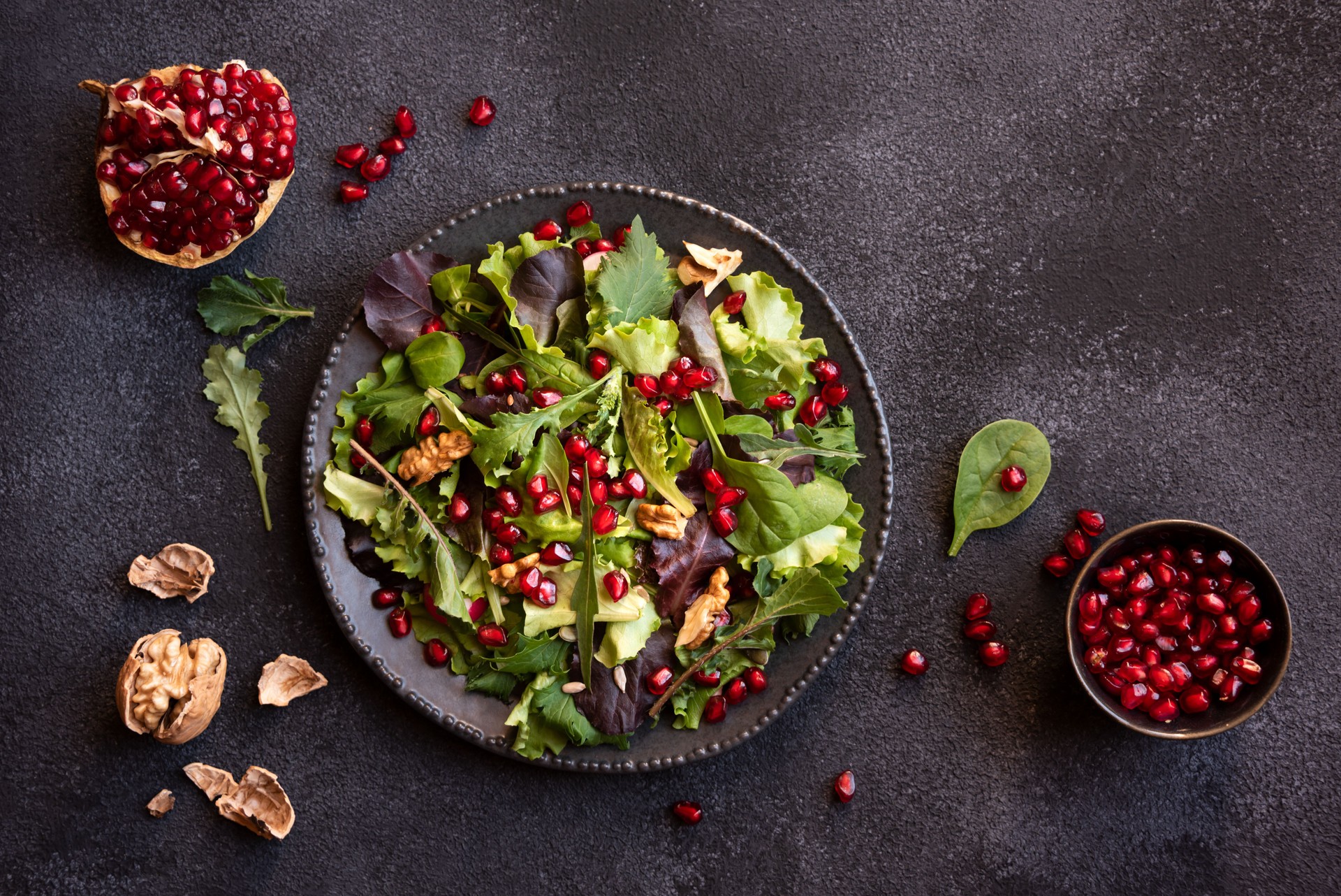Vegetable salad with green leaves, seeds and radish